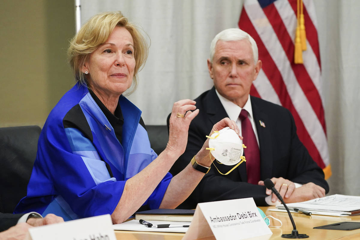Dr. Deborah Birx, Ambassador and White House Coronavirus response coordinator holds a 3M N95 ma ...