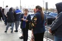 People wait in line at One-Stop Career Center on Tuesday, March 17, 2020, in Las Vegas. The loc ...