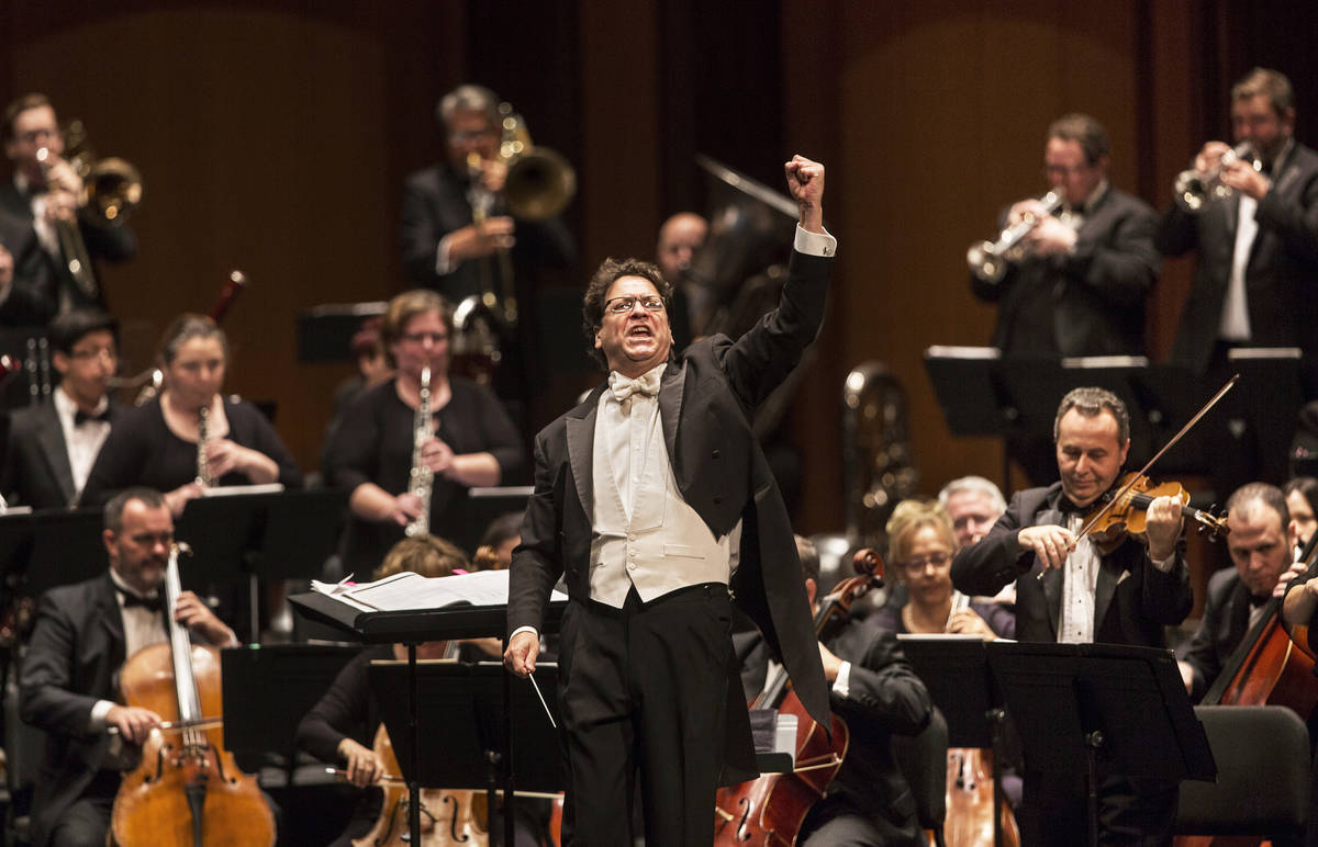 Music Director Donato Cabrera salutes the audience before the start of a performance by the Las ...