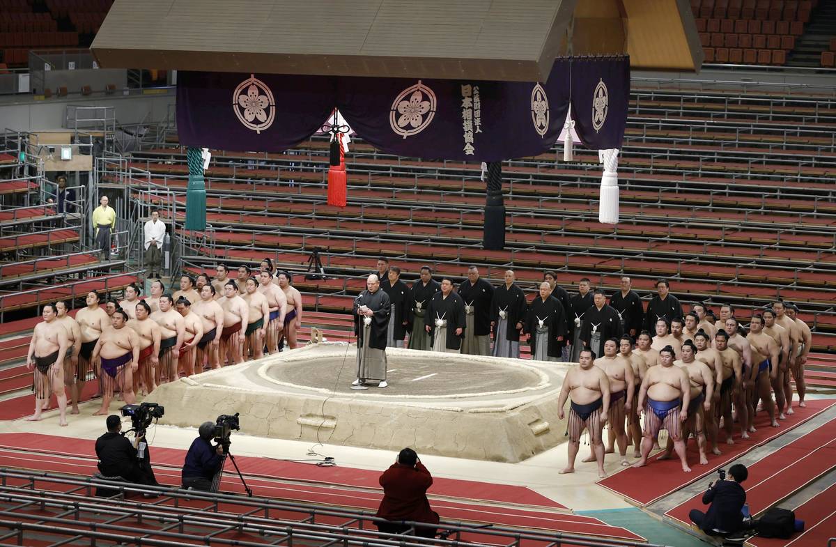 Japan Sumo Association Chairman Hakkaku (on the raised ring) delivers a speech in closing the S ...