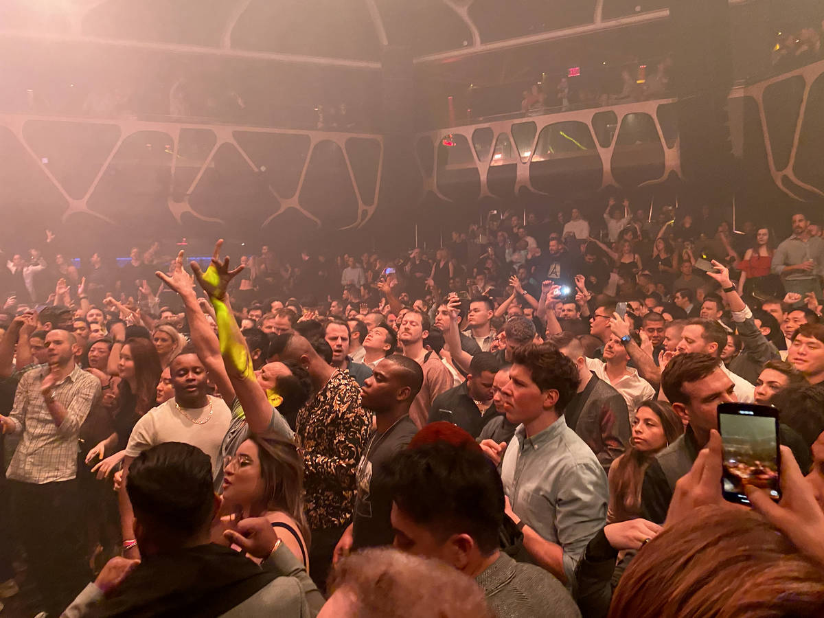 CES conventioneers and clubgoers dance to Tiesto during the DreamlandXR Closing Night Party at ...