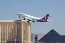 A Hawaiian Airlines jetliner departs from McCarran International Airport in Las Vegas on Wednes ...