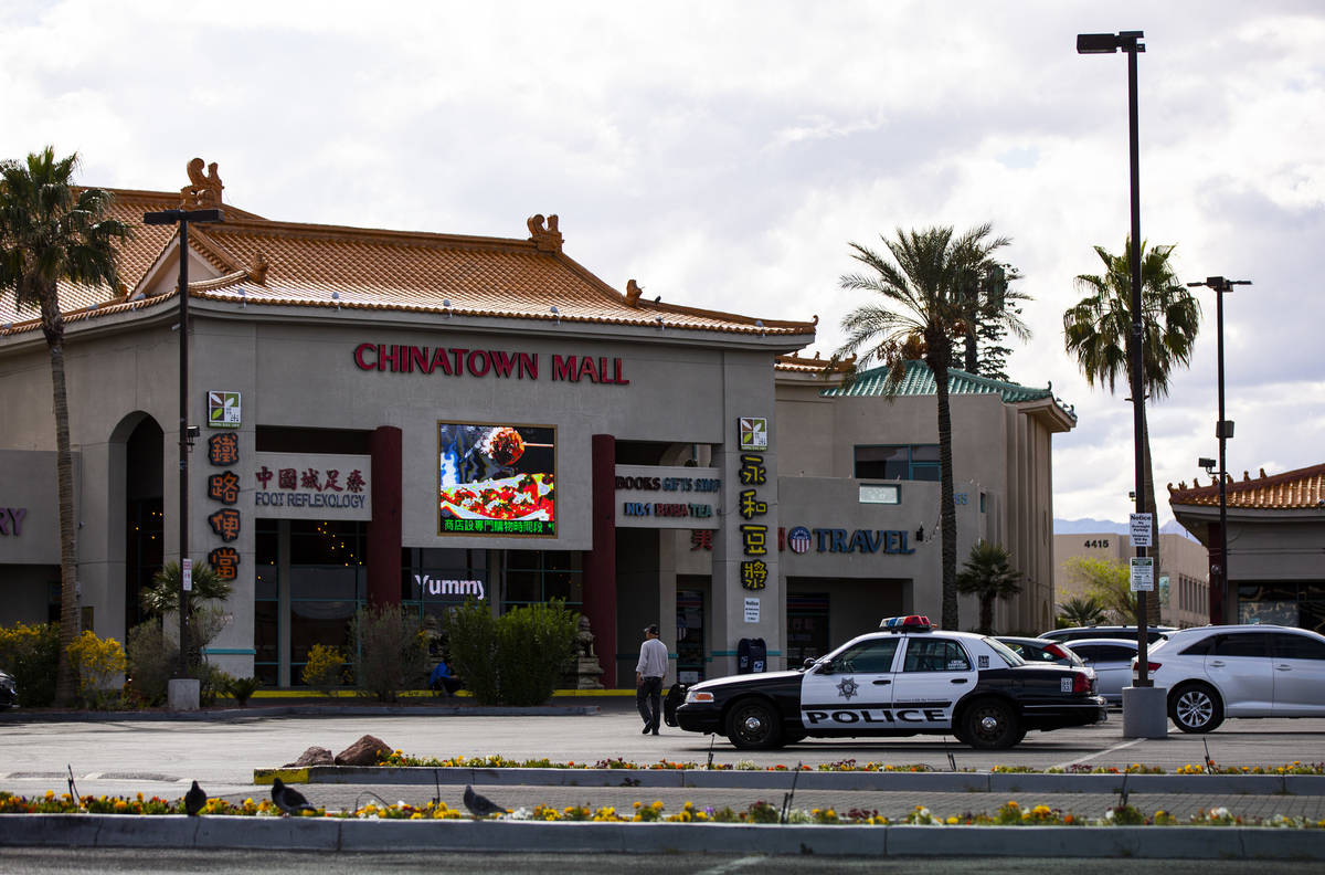 A Las Vegas police car sits in the parking lot of Chinatown Plaza on Saturday, March 21, 2020, ...
