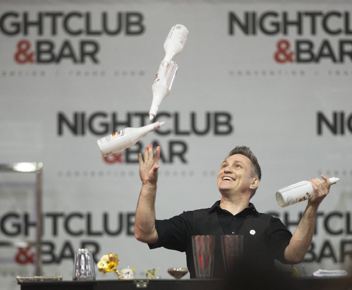 Ryan Clark performs in the flair bartending competition at the Nightclub & Bar Show in 2019, at ...