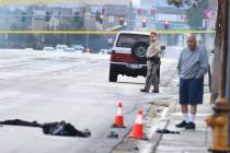 Las Vegas Metropolitan Police Department officers investigating after two male pedestrians were ...