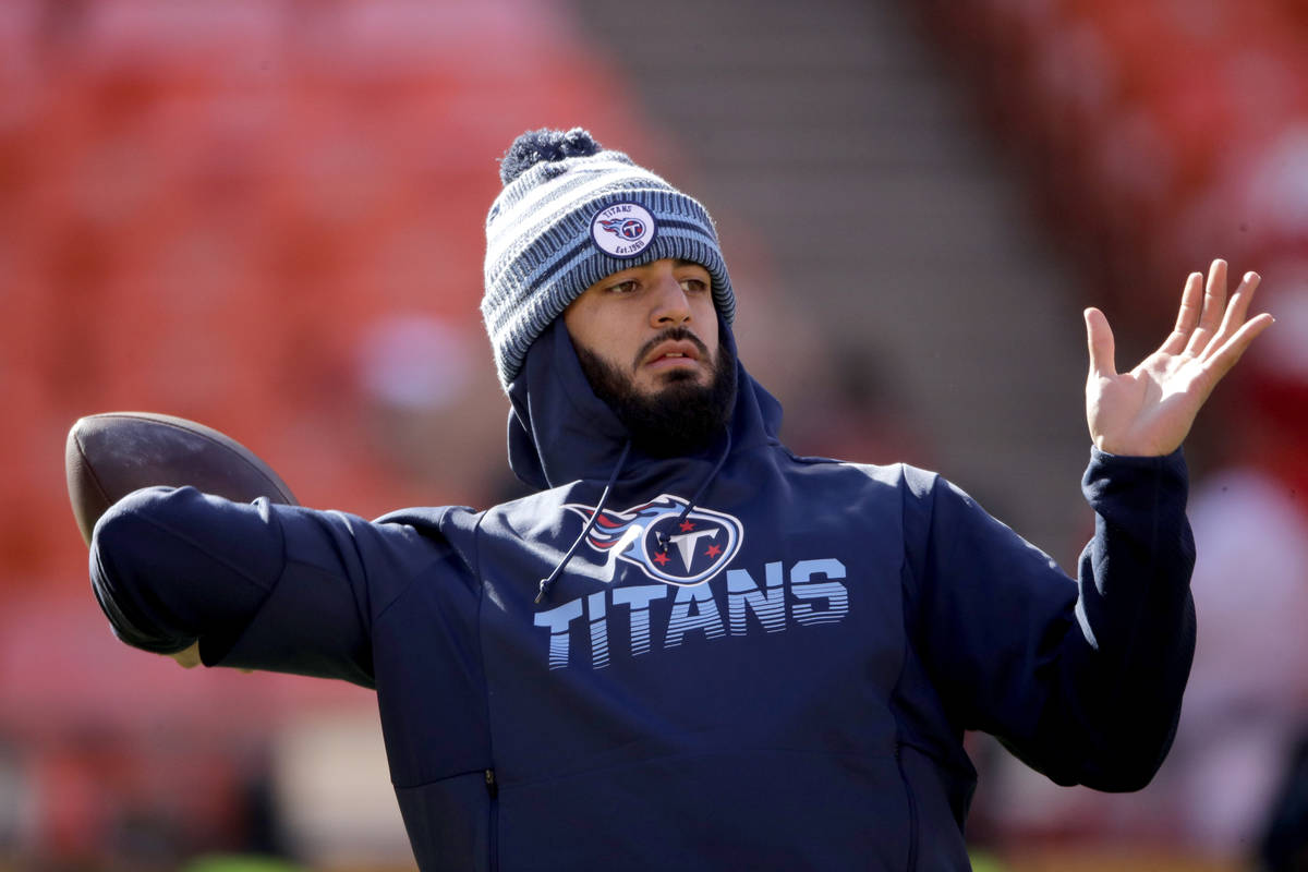 FILE - In this Jan. 19, 2020, file photo, Tennessee Titans' quarterback Marcus Mariota warms up ...