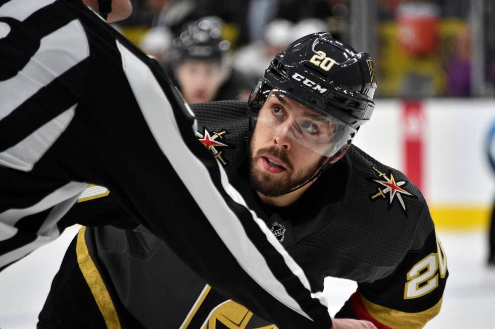 Vegas Golden Knights center Chandler Stephenson (20) waits for the puck to drop in a face off a ...