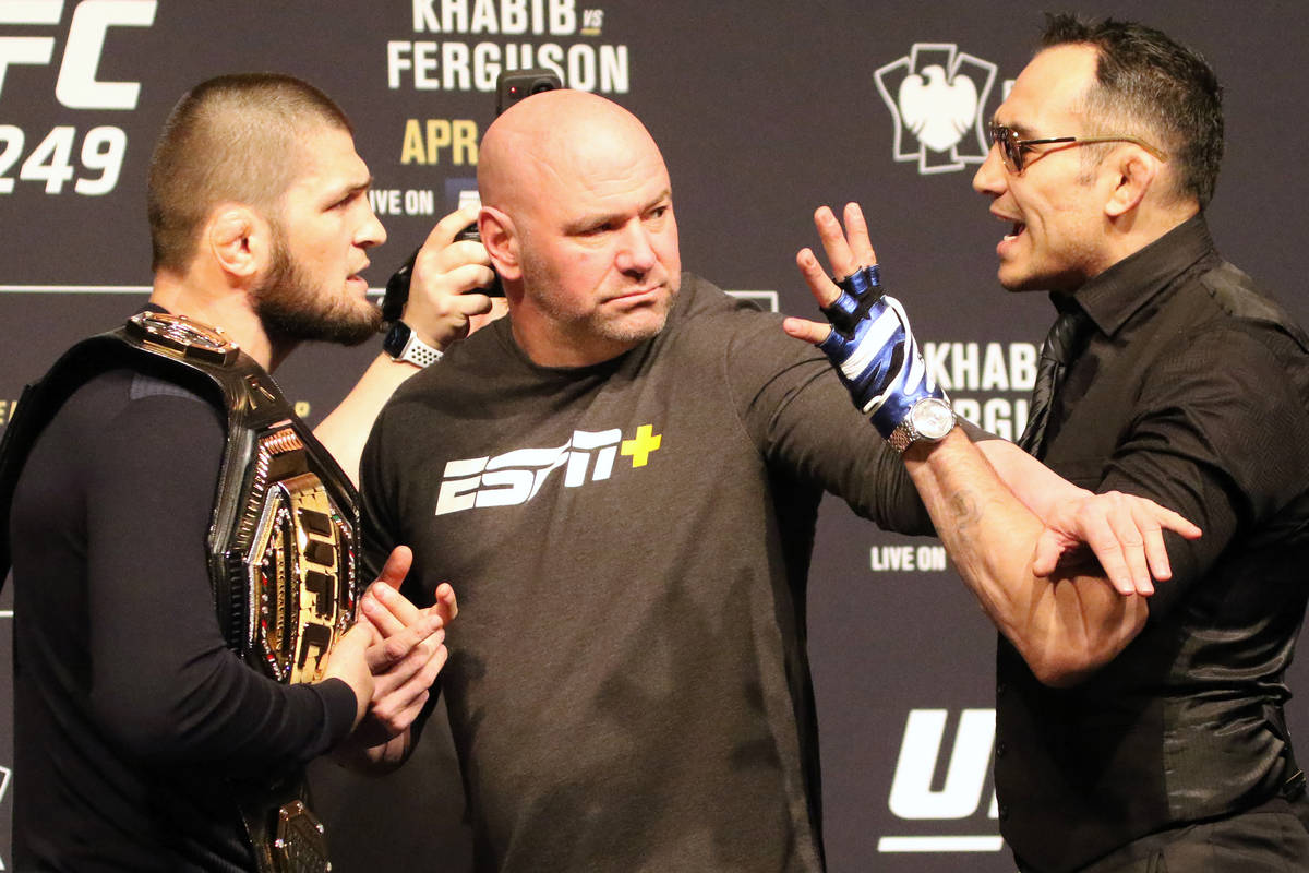 UFC lightweight champion Khabib Nurmagomedov, left, engages in a face off with Tony Ferguson, ...