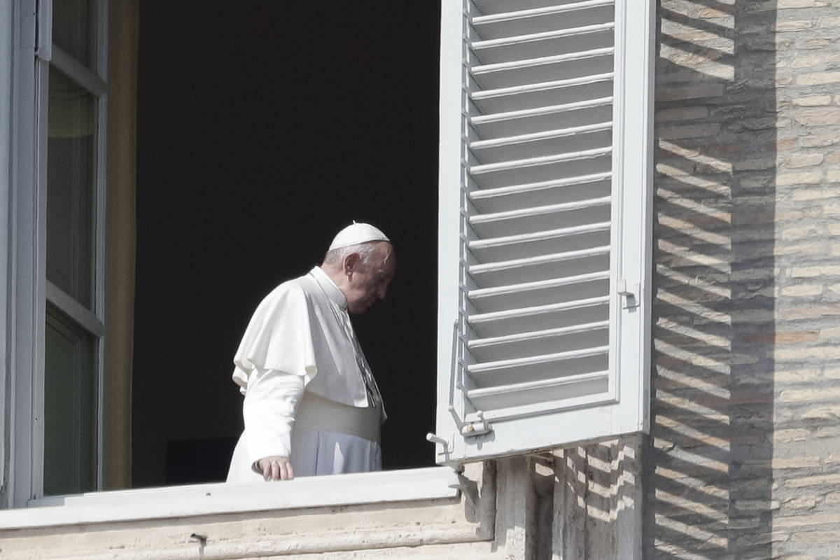 Pope Francis leaves after delivering his blessing at the Vatican, Sunday, March 22, 2020. Durin ...
