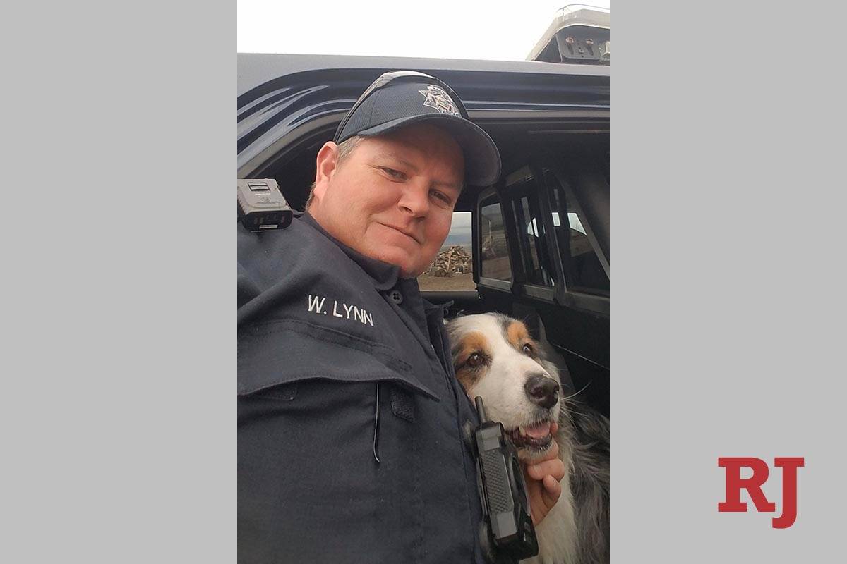 Nevada Highway Patrol Trooper W. Lynn with rescued dog, Tucker. (NHP Twitter post)