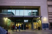 People walk outside of the Clark County Detention Center in downtown Las Vegas. (Chase Stevens/ ...