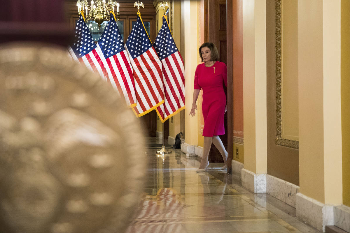 House Speaker Nancy Pelosi of Calif. arrives to read a statement outside her office on Capitol ...