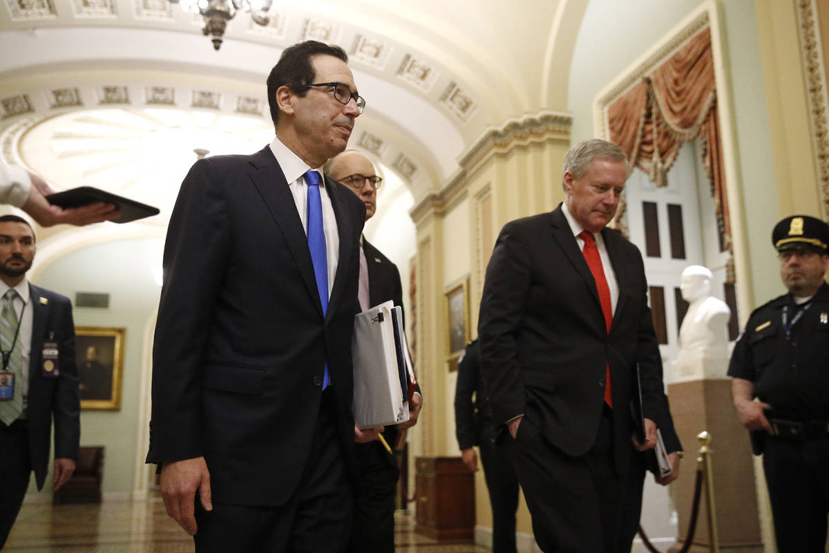 Treasury Secretary Steven Mnuchin, left, accompanied by White House Legislative Affairs Directo ...
