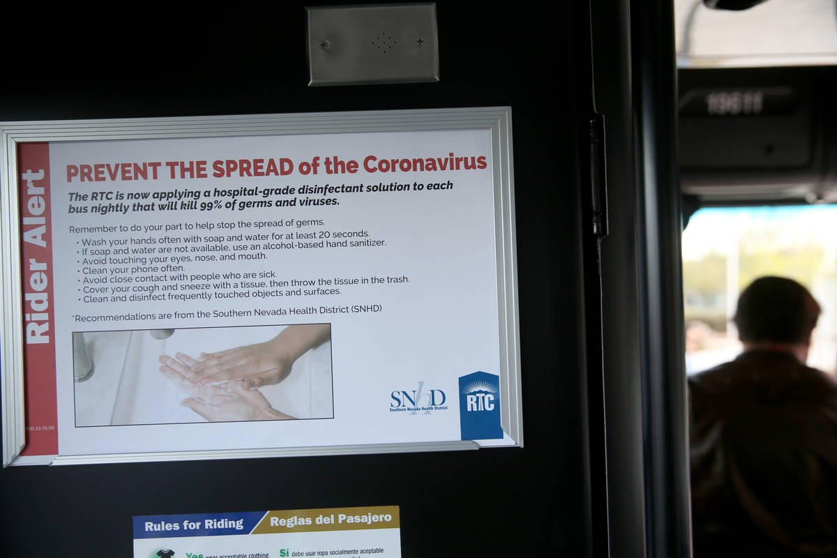 A coronavirus informational sign on a Regional Transportation Commission bus at the Sunset Main ...