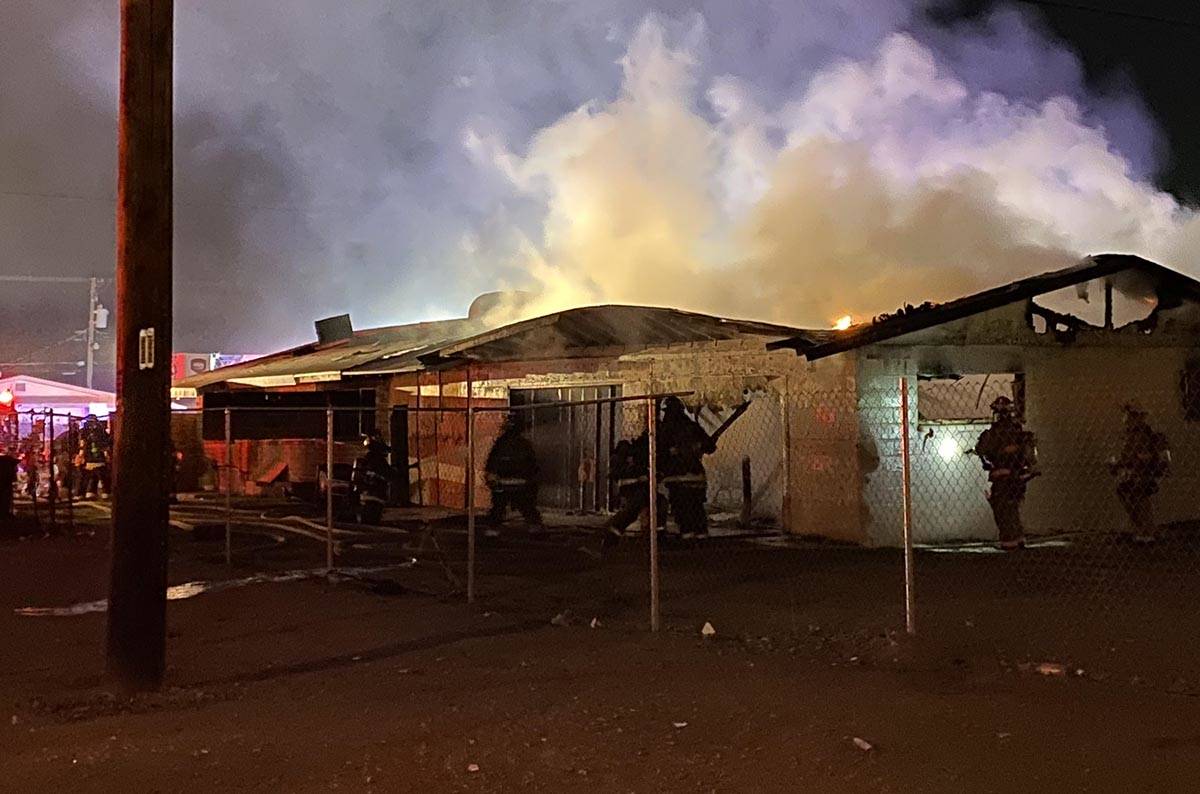 North Las Vegas firefighters battle a blaze at 2511 McCarran St. about 5 a.m. Friday, Feb. 7, 2 ...