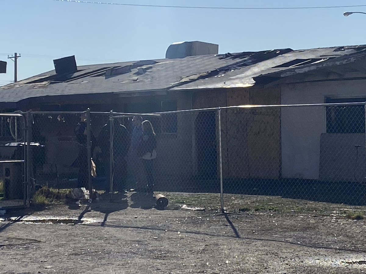 North Las Vegas police and fire inspectors investigate a fatal fire on Friday, Feb. 7, 2020, at ...