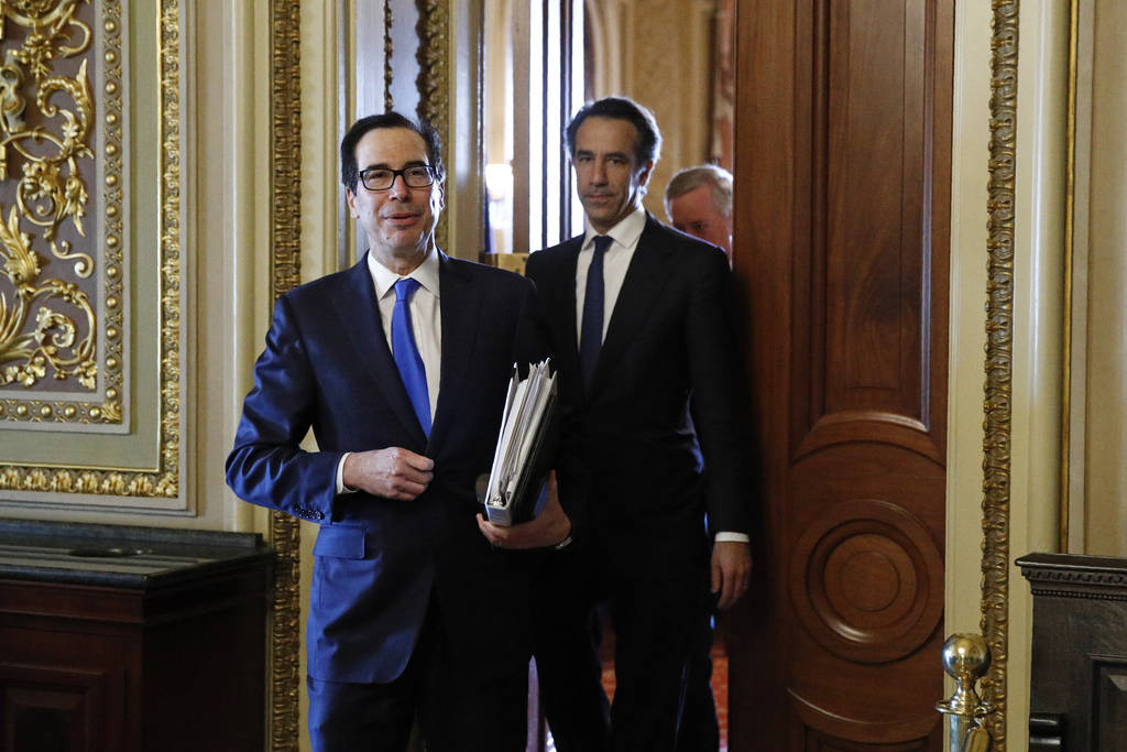 Treasury Secretary Steve Mnuchin steps out of a meeting on Capitol Hill in Washington, Tuesday, ...