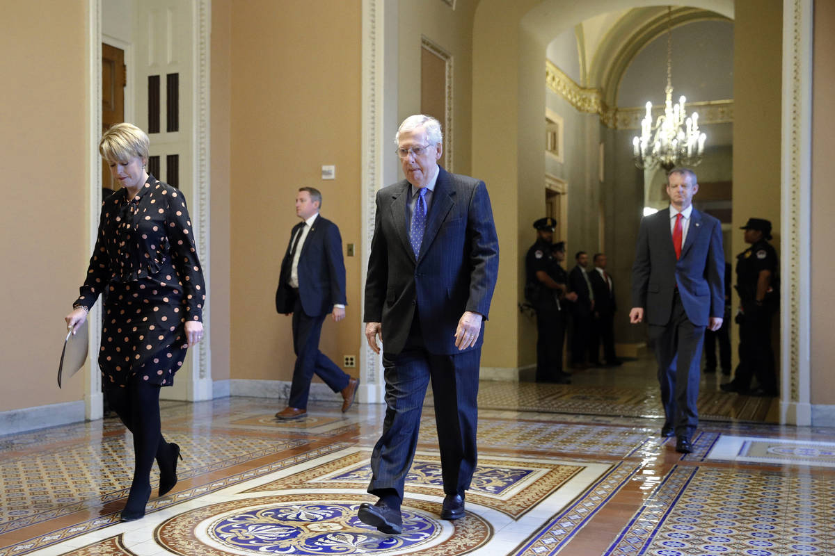 Senate Majority Leader Mitch McConnell of Ky. walks to the Senate chamber on Capitol Hill in Wa ...