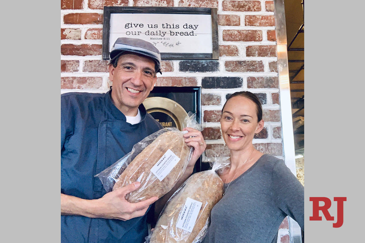 Gio and Naomi Mauro are shown showing off bread loaves at Pizzeria Monzu on Wednesday, March 25 ...