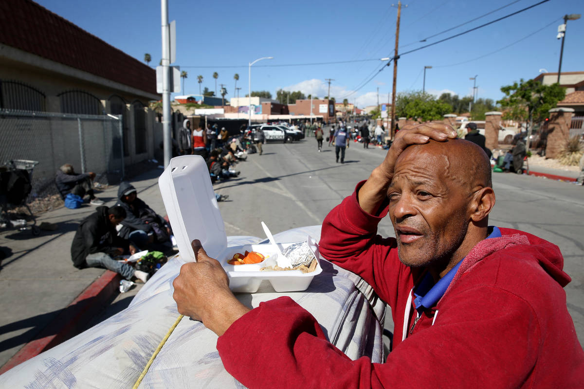 Tony Brown, 64, with his to-go lunch from Catholic Charities on Foremaster Lane in Las Vegas Th ...
