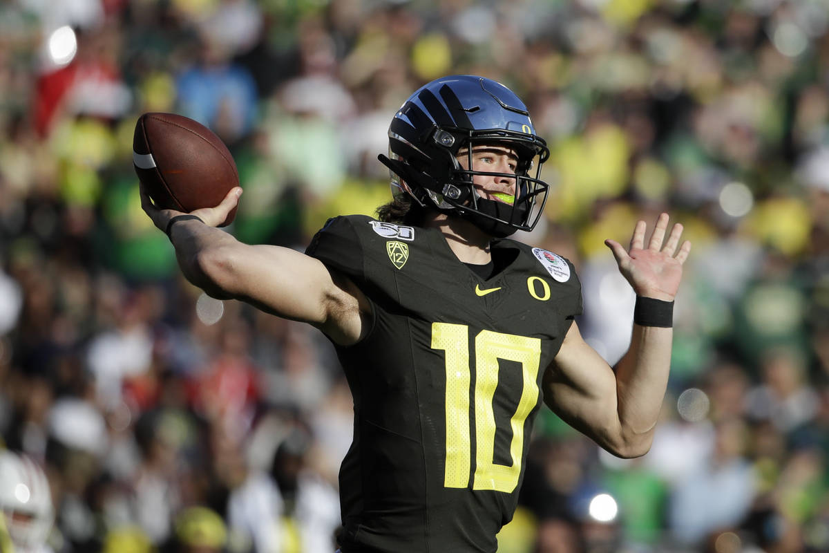 Oregon quarterback Justin Herbert passes against Wisconsin during first half of the Rose Bowl N ...