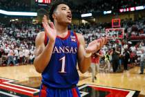 FILE - In this March 7, 2020, file photo, Kansas' Devon Dotson (1) celebrates after an NCAA col ...
