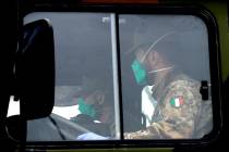 Military trucks moving coffins of deceased people leave the cemetery of Bergamo, one of the are ...