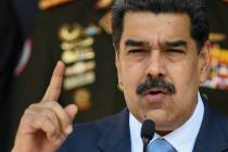 In this March 12, 2020, file photo, Venezuelan President Nicolas Maduro speaks at a press confe ...