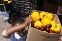 Zenebech Beyene picks up food during a food bank distribution at Veterans Village in downtown L ...