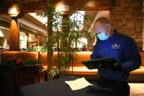 Lawrence D., floor manager of Pampas Las Vegas, processes an order at the restaurant in the Mir ...