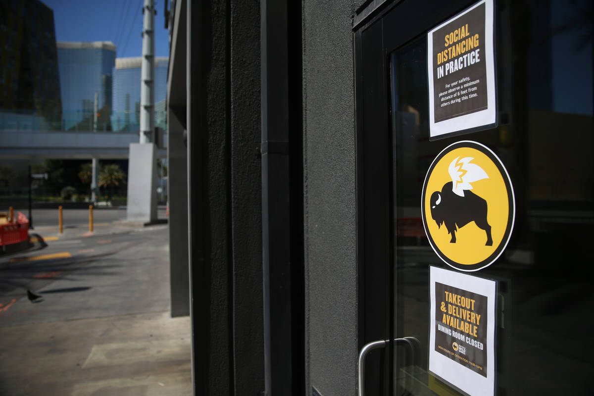 A sign for the open Buffalo Wild Wings in the Miracle Mile Shops in Las Vegas, Thursday, March ...