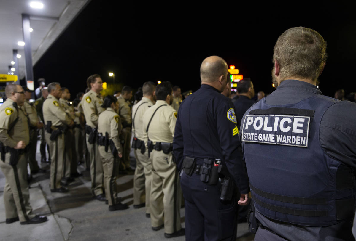 Members of law enforcement meet before starting the procession for Nevada Highway Patrol Sgt. B ...