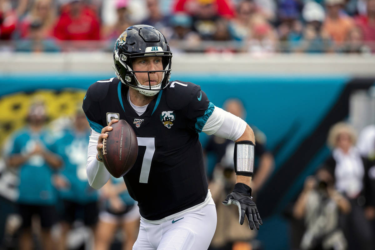 FILE - In this Dec. 1, 2019, file photo, Jacksonville Jaguars quarterback Nick Foles (7) scramb ...