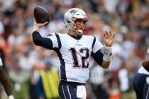 New England Patriots quarterback Tom Brady (12) looks to pass during the second half of an NFL ...