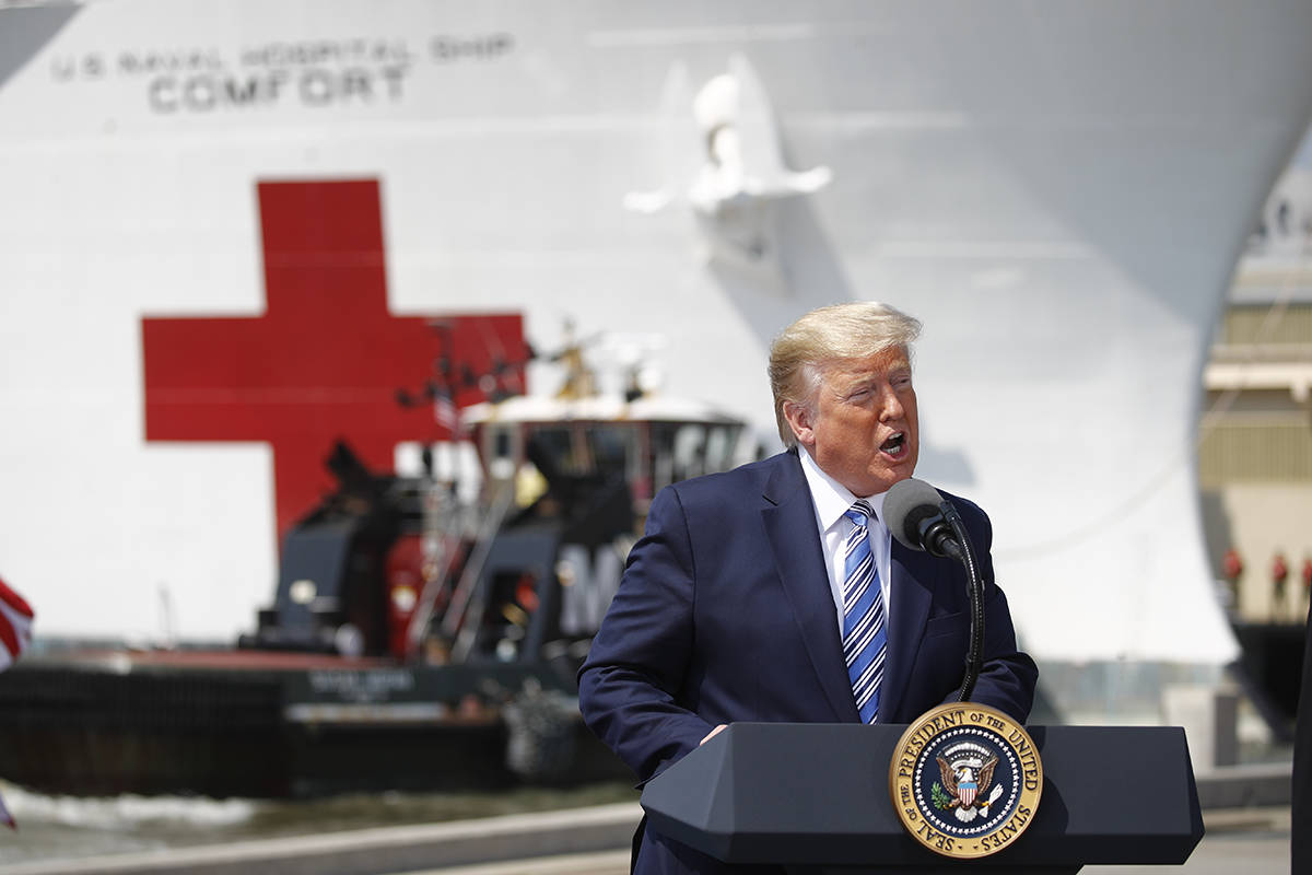 President Donald Trump speaks in front of the U.S. Navy hospital ship USNS Comfort at Naval Sta ...