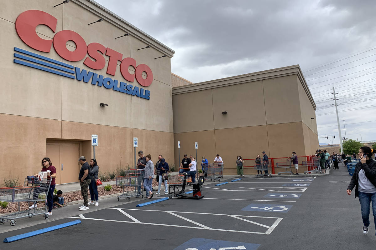 People wait in line in front of Costco at 791 Marks St, in Henderson, Sunday, March 29, 2020. ...