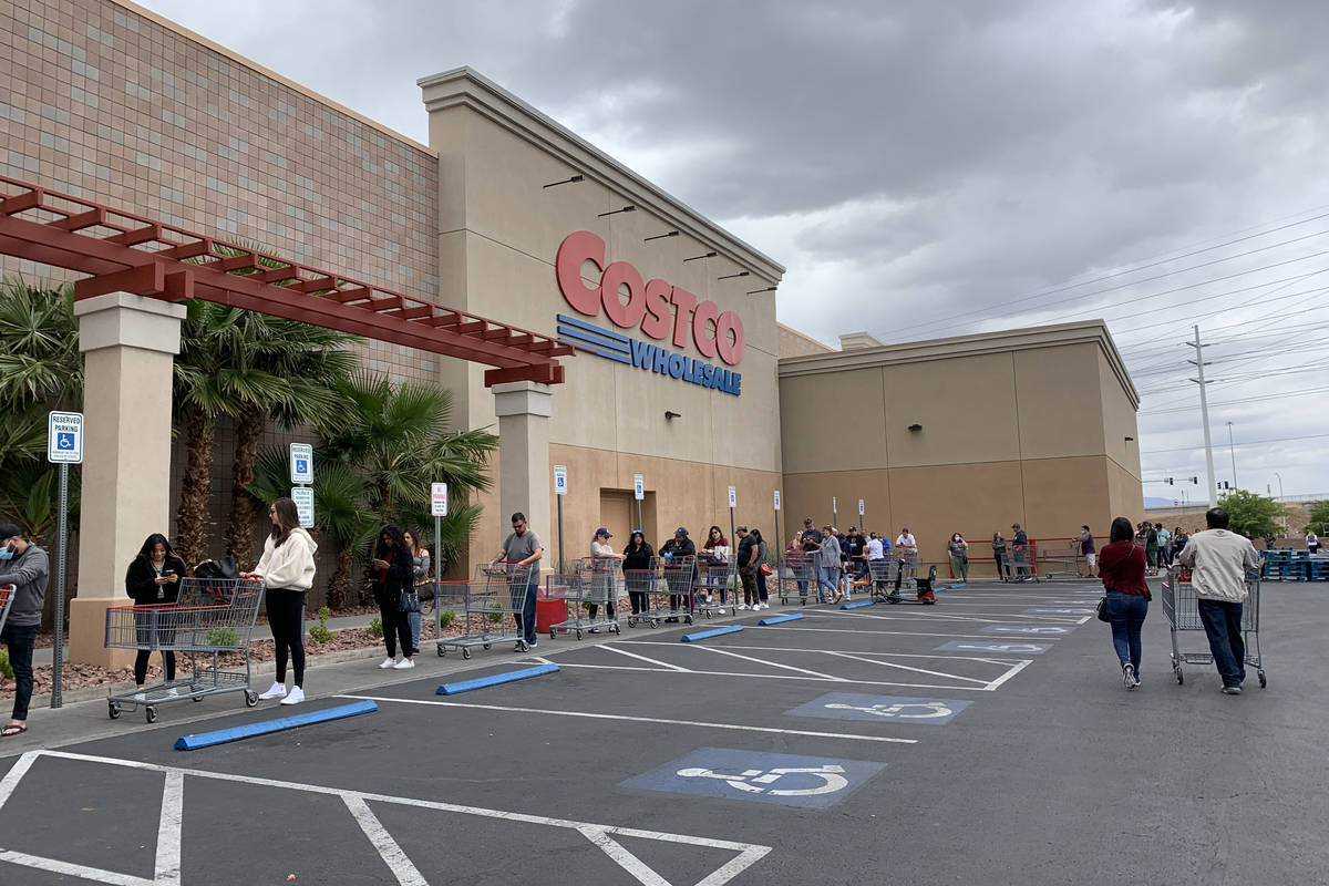 People wait in line in front of Costco at 791 Marks St, in Henderson, Sunday, March 29, 2020. ...