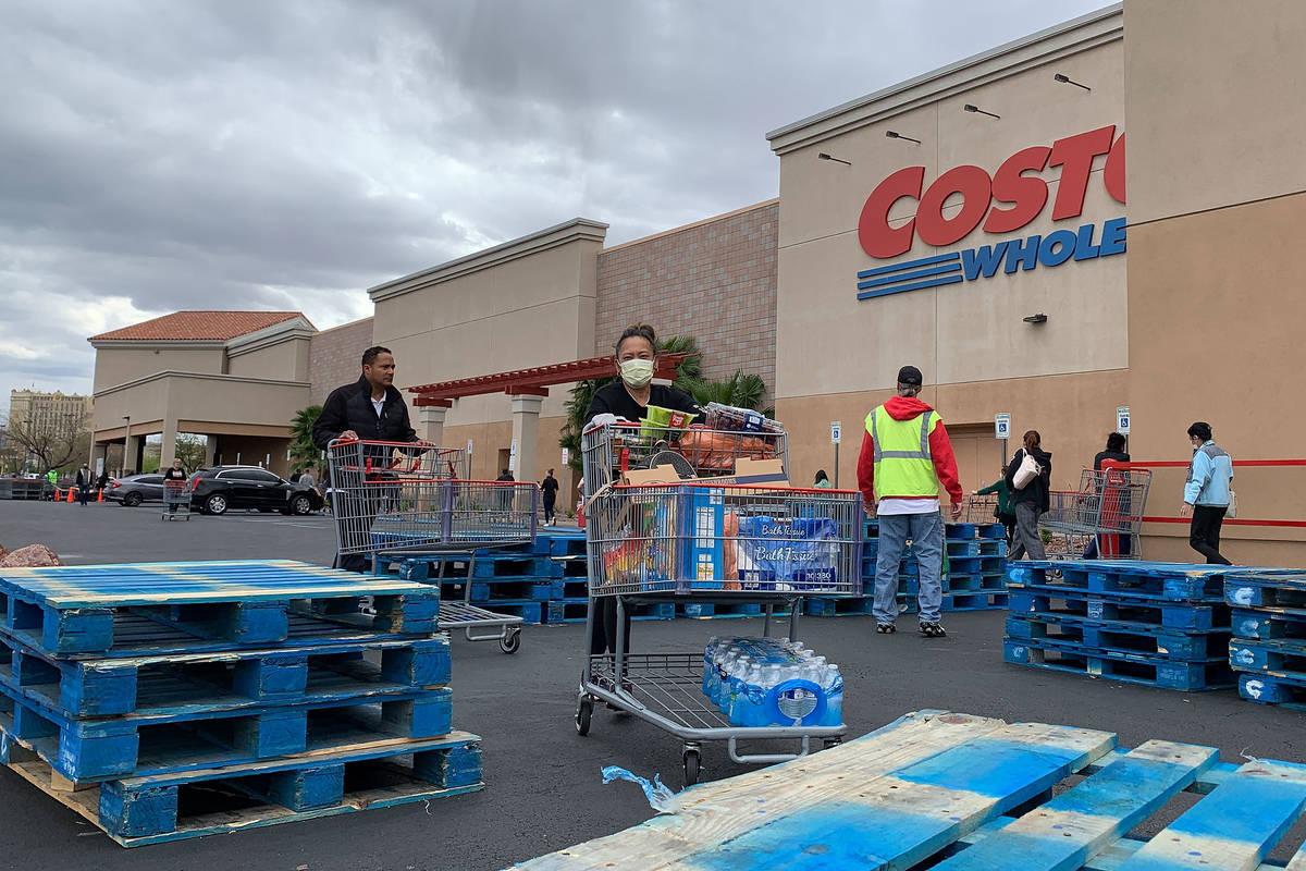Shoppers push the carts in front of Costco at 791 Marks St, in Henderson, Sunday, March 29, 202 ...