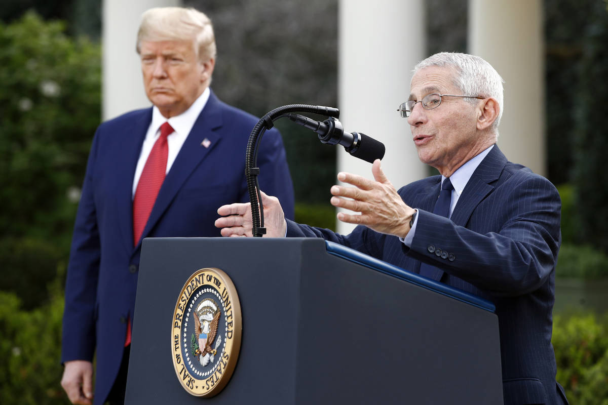 President Donald Trump listens as Dr. Anthony Fauci, director of the National Institute of Alle ...