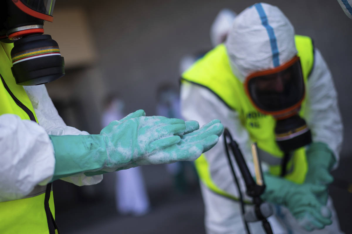 Spanish Royal Guard soldiers during disinfection work at a hospital to prevent the spread of th ...