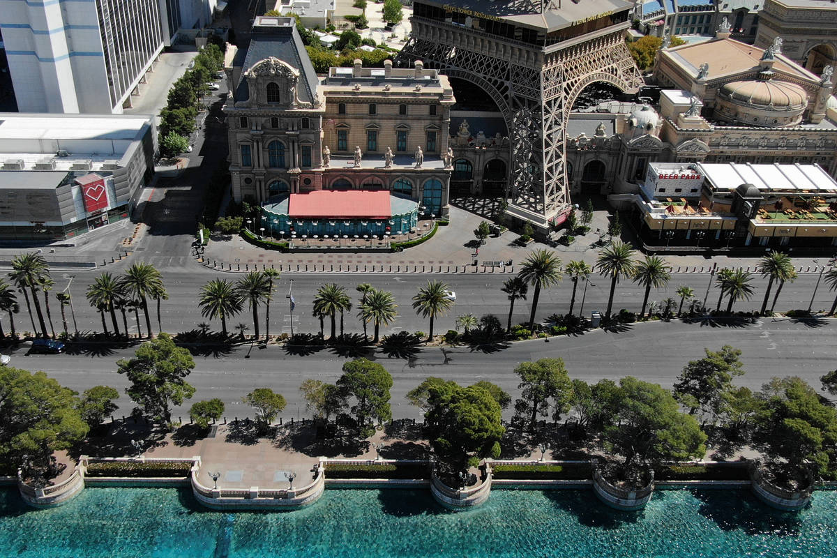 The sidewalks in front the Bellagio and Paris Las Vegas on the Las Vegas Strip are vacant, Frid ...