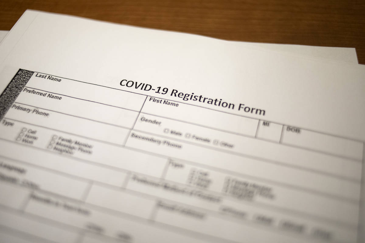 A COVID-19 registration form is used at a call center at a UNLV Medicine office space on Tuesda ...