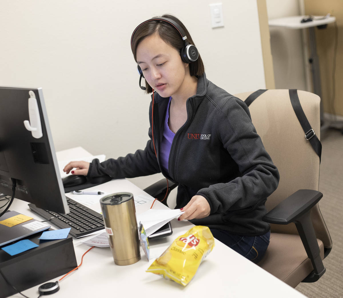Second-year UNLV medical student Elli Tian asks about a potential coronavirus patient's symptom ...