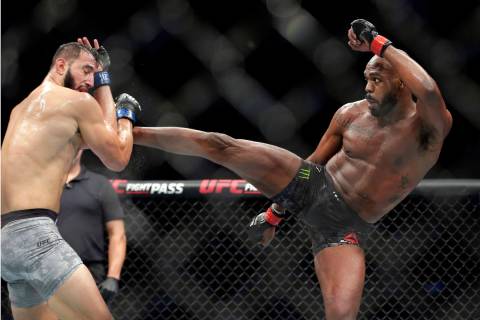 Dominick Reyes, left, and Jon Jones, right, during a light heavyweight mixed martial arts bout ...