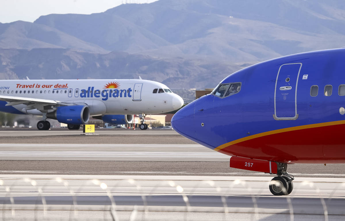 Planes taxi to the runway at McCarran International Airport in Las Vegas, Monday, Nov. 20, 2017 ...