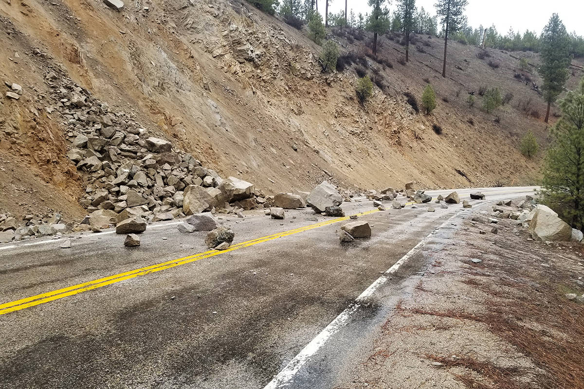 This photo provided by Tyler Beyer shows a rockslide on Highway 21 near Lowman, Idaho, after a ...