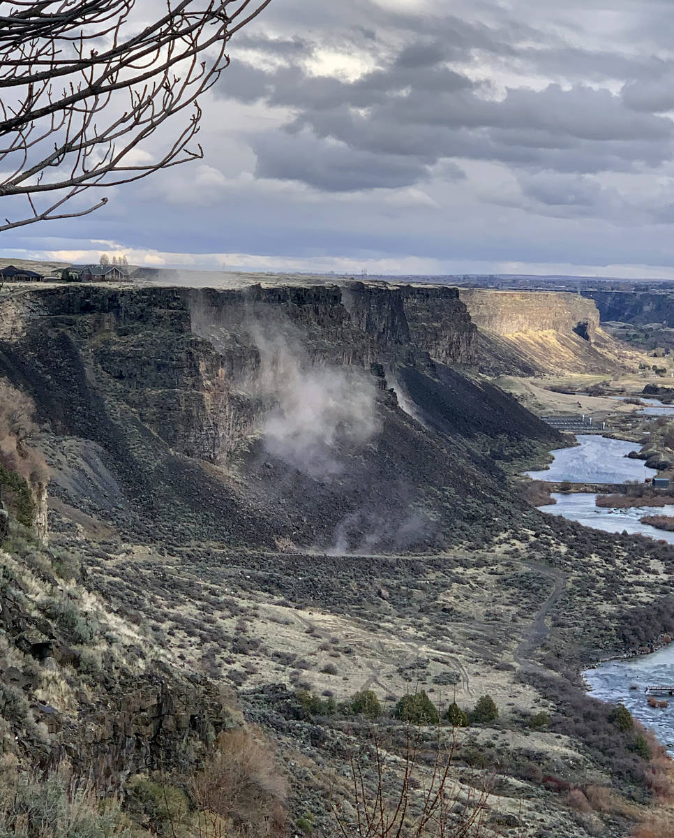 In a photo provided by Israel Bravo, rocks fall from the north side of the Snake River Canyon d ...