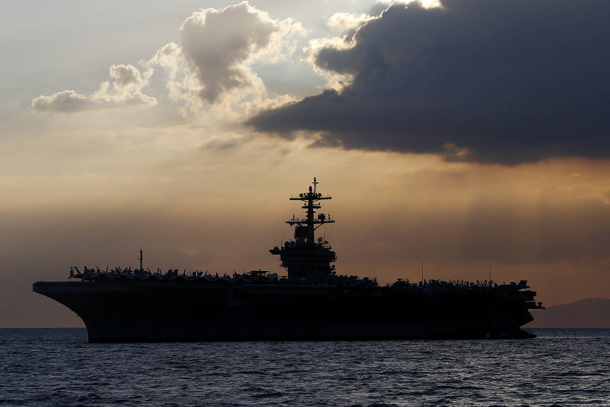 FILE - In this April 13, 2018, file photo the USS Theodore Roosevelt aircraft carrier is anchor ...