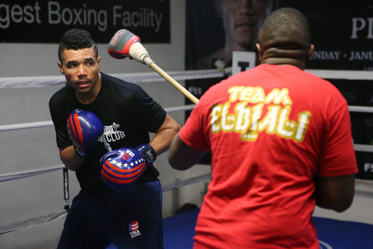 Rahim Gonzales, left, with his assistant trainer Marvin Rutta, during a workout at City Boxing ...