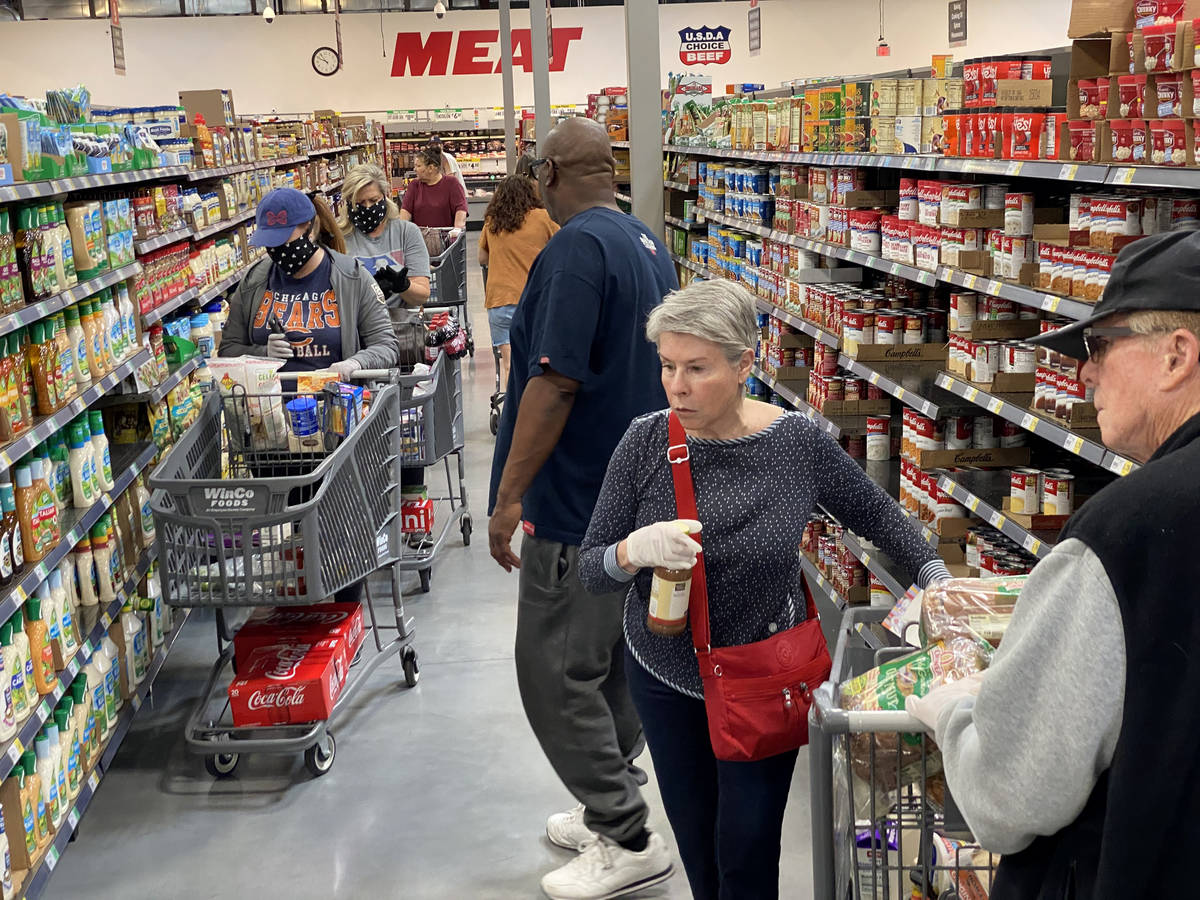 Shoppers at WinCo Foods at 7501 Washington Ave. in Las Vegas Tuesday, March 31, 2020. (K.M. Can ...